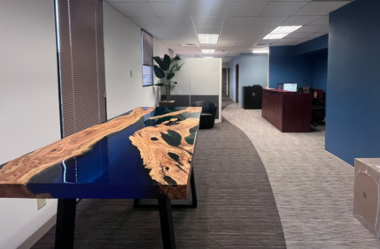 Large table in renovated office space.